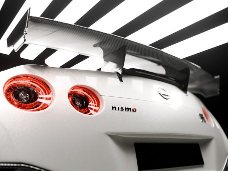 Weißes Sportauto mit großem Heckspoiler und roten Rückleuchten. Nissan GT-R. 3D Render